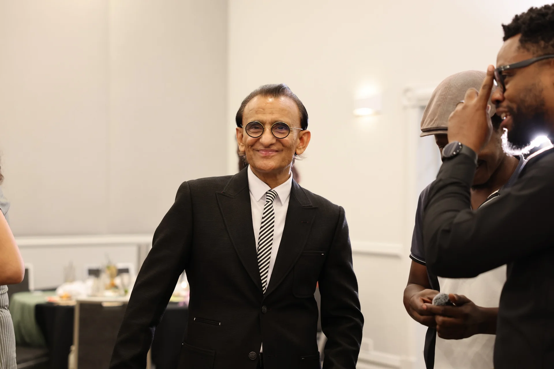 Community members smiling together at a Zaffarology event